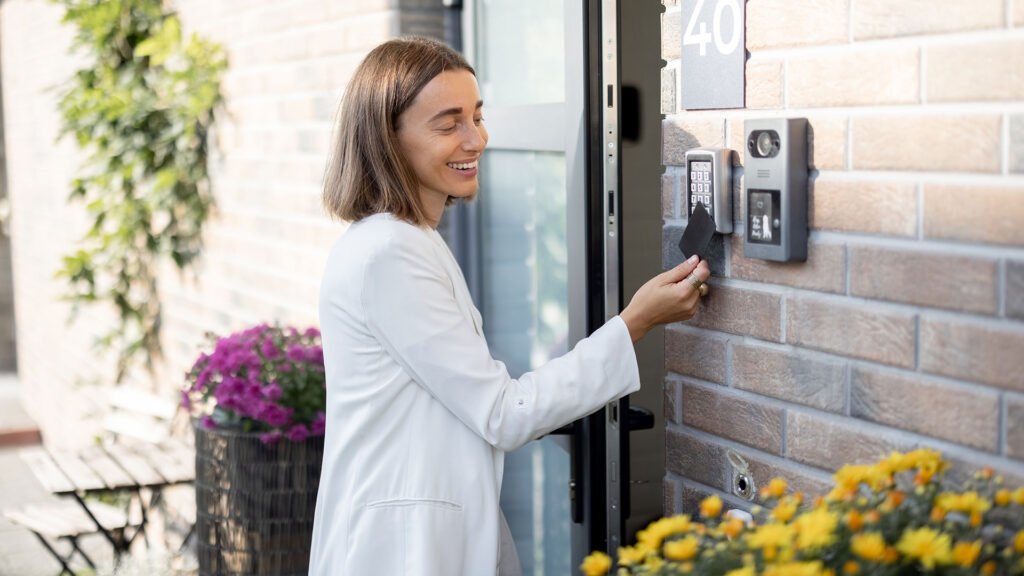 woman-gets-access-to-enter-home-by-card-6WYL2KY.jpg